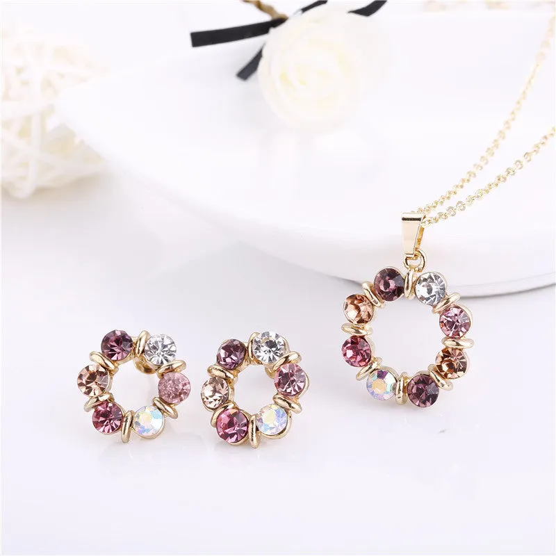 Two piece set of circular colored diamond necklace and earrings