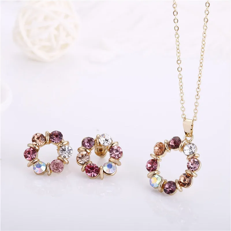 Two piece set of circular colored diamond necklace and earrings